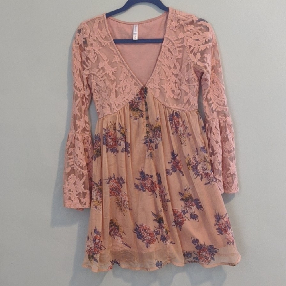 Bell sleeve embroidered dress.